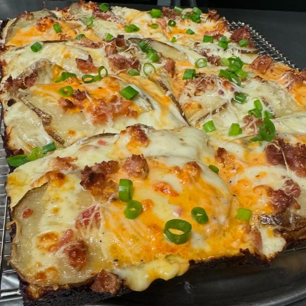 MT's Pizza King's loaded potato pizza with melted cheese, bacon, and green onions.